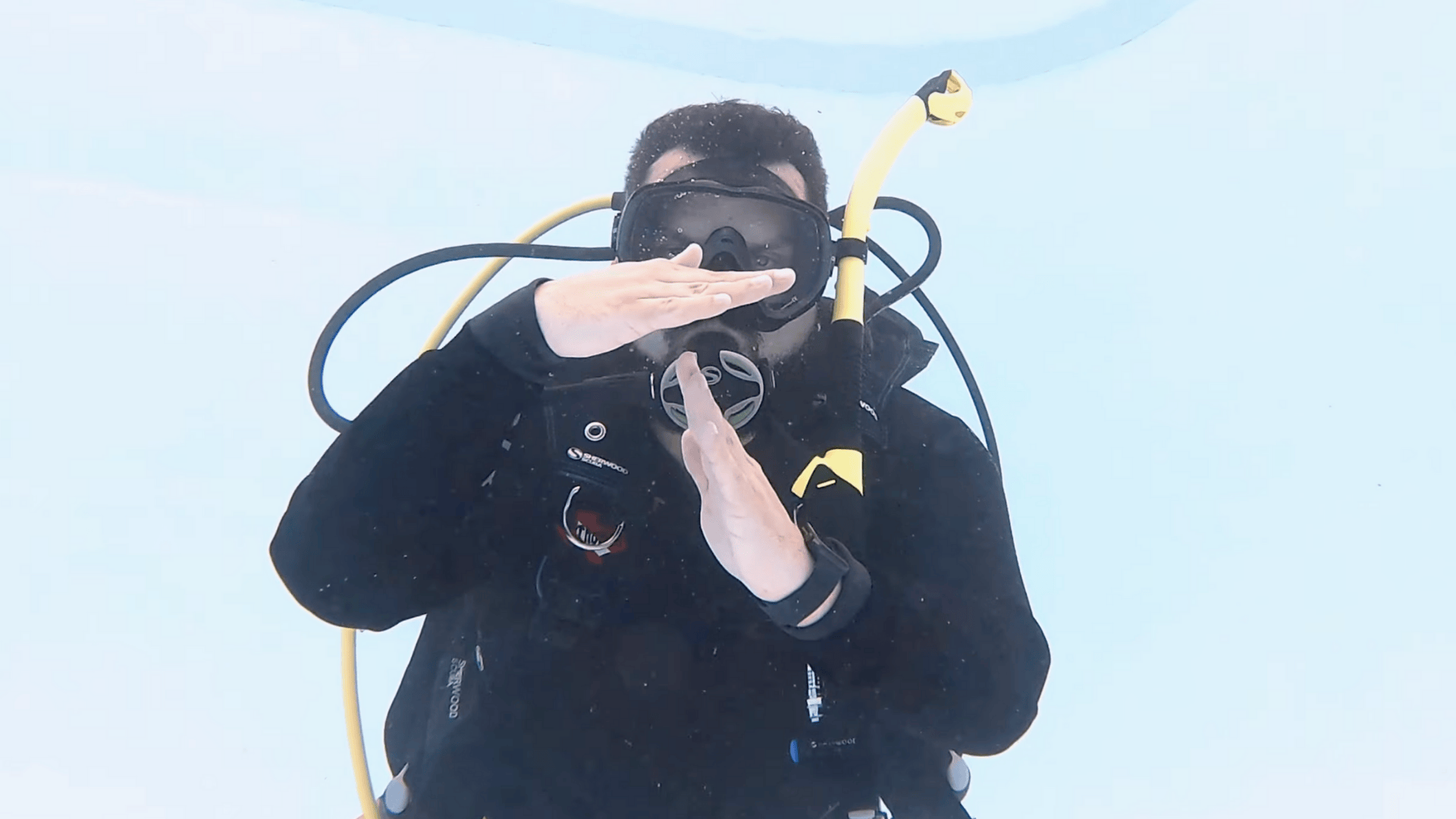 half tank scuba hand signal