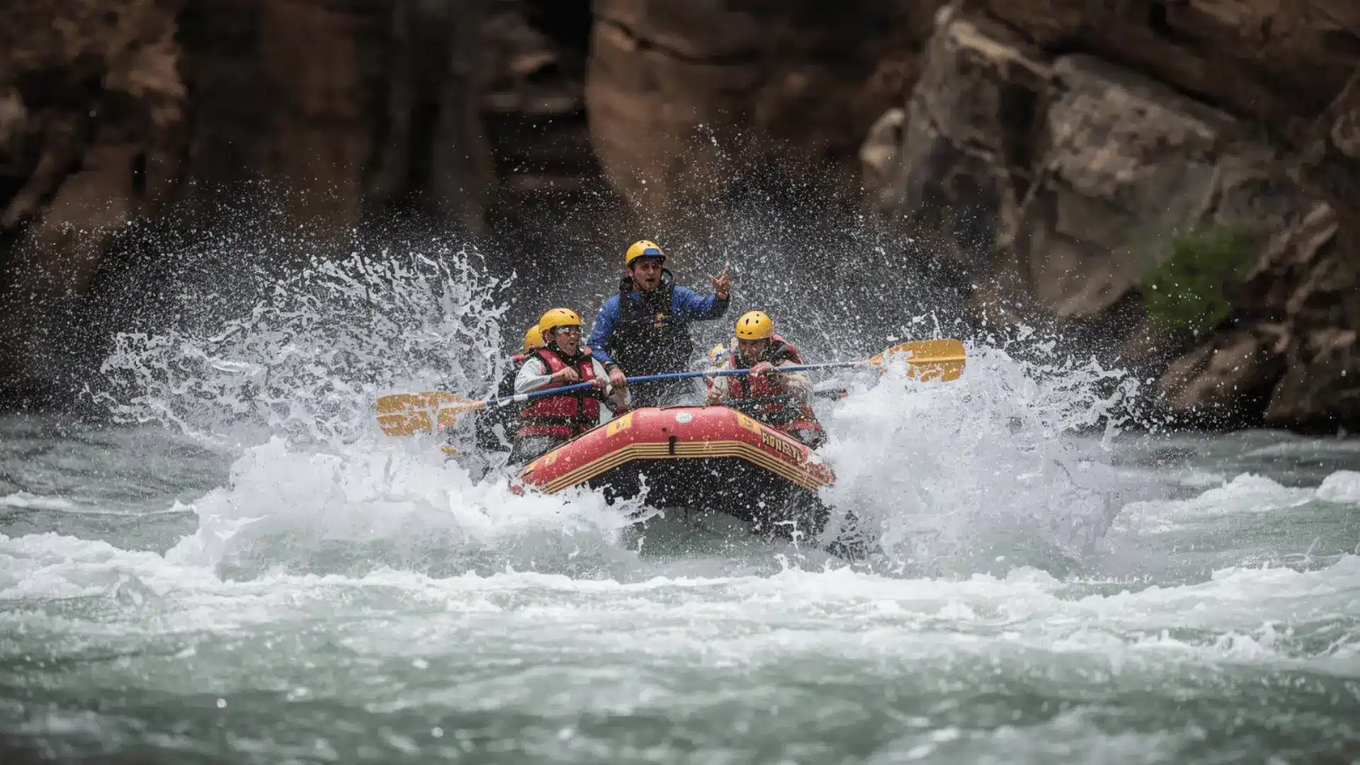 A group of people navigating a raft through turbulent whitewater on a river adventure