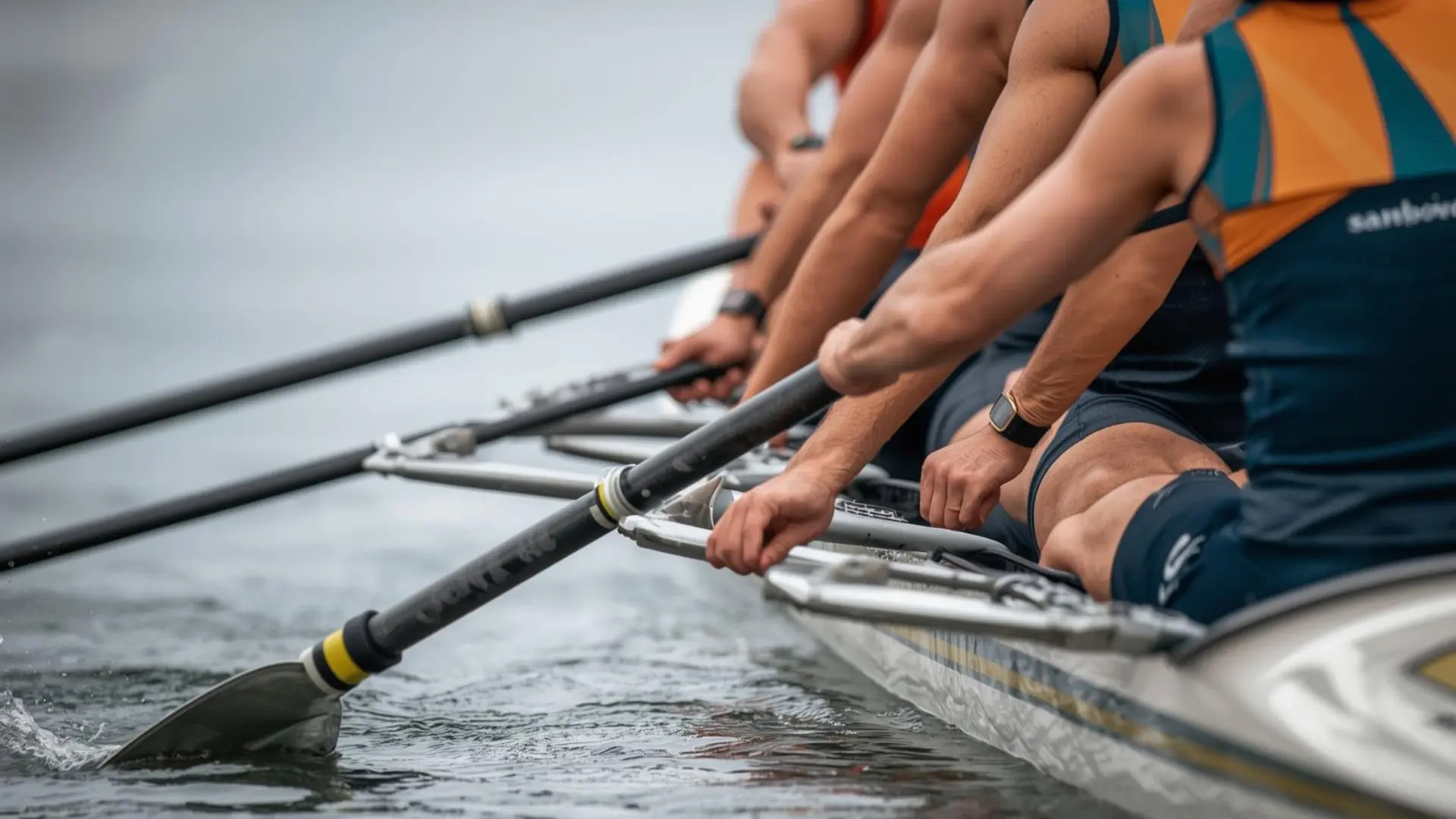 A rower actively rows in a dragon boat, highlighting the sport's dynamic and collaborative nature on the water.