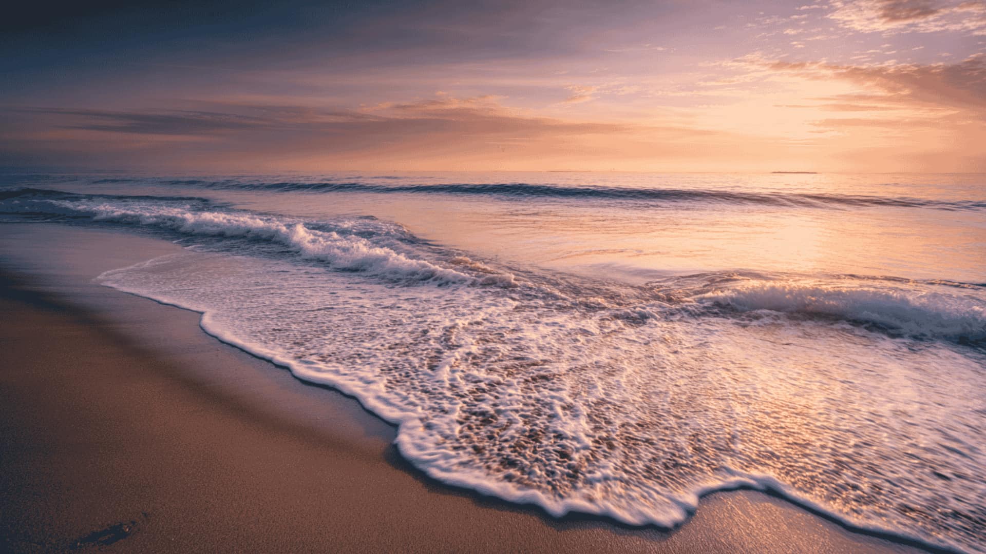 Ocean waves rolling onto a quiet shore at sunset, rhythmic running water sound for sleep, relaxation, and winding down