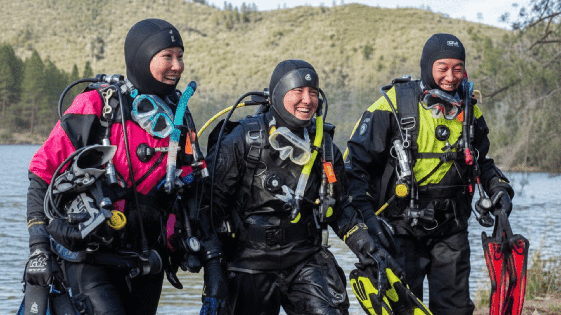 scuba divers wearing drysuits