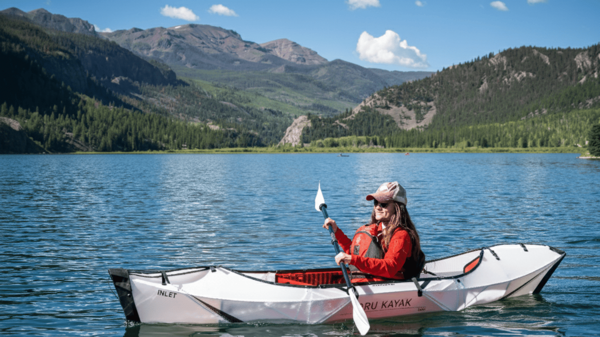 woman riding oru lake kayak on water