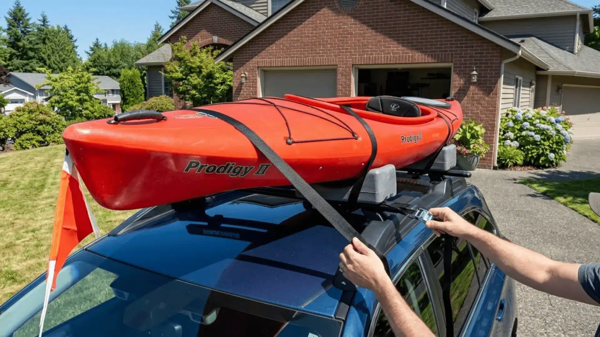 Person-Securing-Kayak-On-Roof-With-Cam-Buckle-Straps