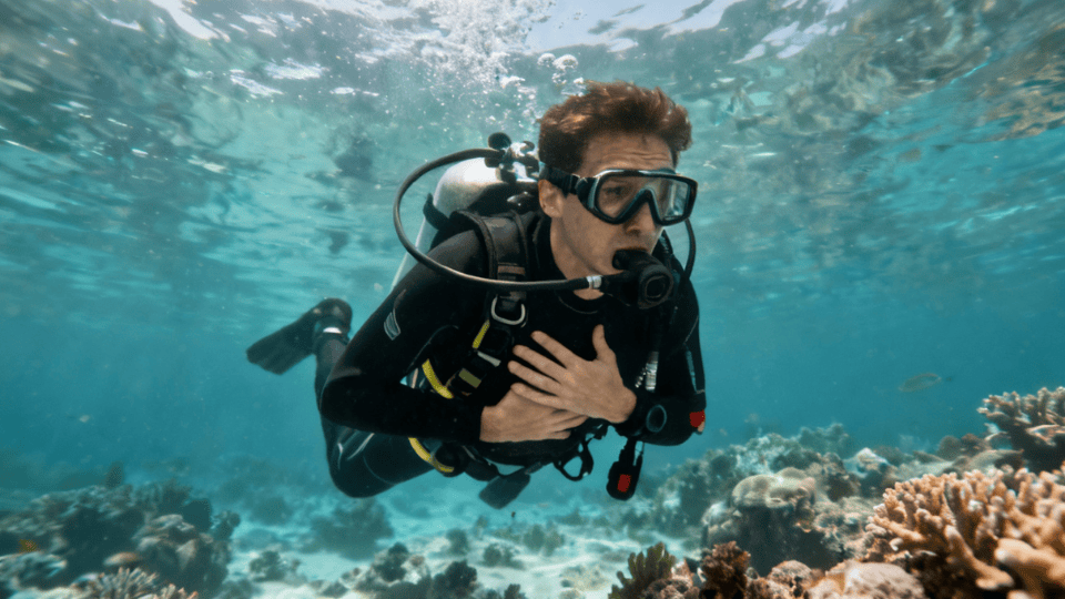 diver underwater, struggling with discomfort or difficulty while diving.