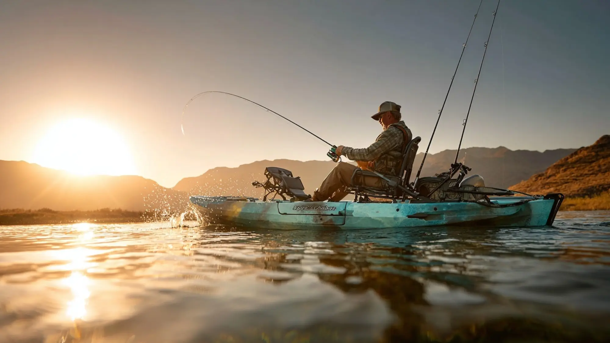 A man in a Hobie Outback kayak casts his line while fishing at sunset, surrounded by a serene, colorful sky.
