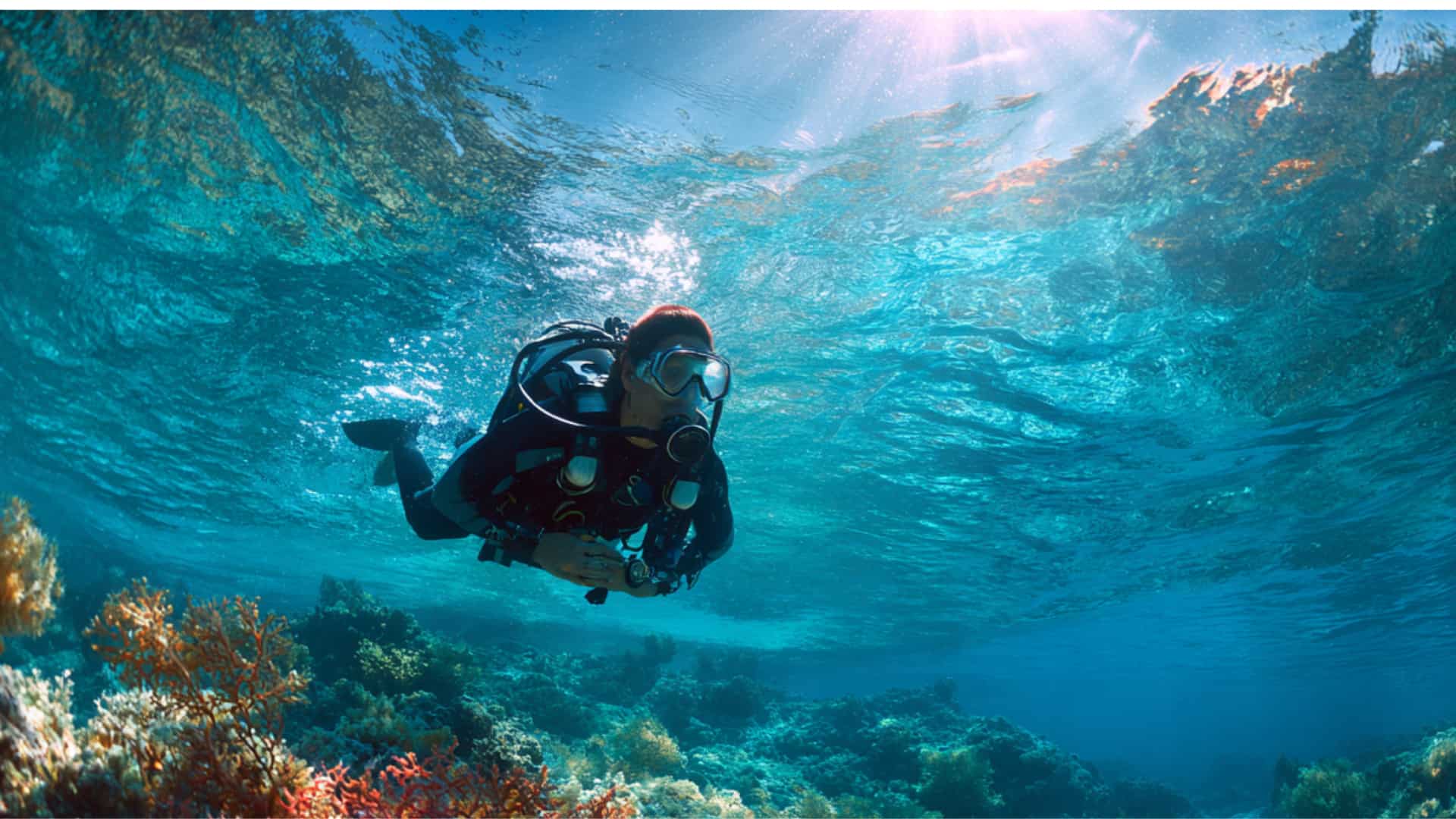 scuba diver underwater with full diving equipment