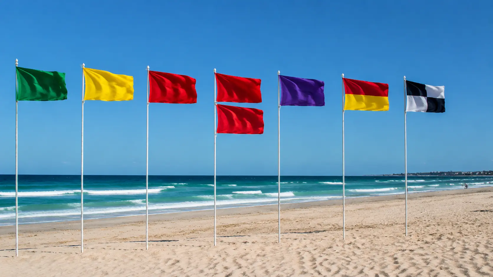 Colorful flags on a sunny beach