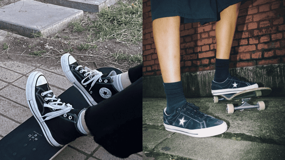 Skateboarders wearing black Converse skate shoes