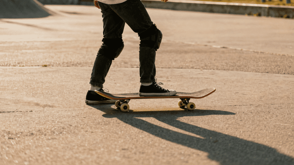 slowing down on skateboard using foot drag on flat pavement