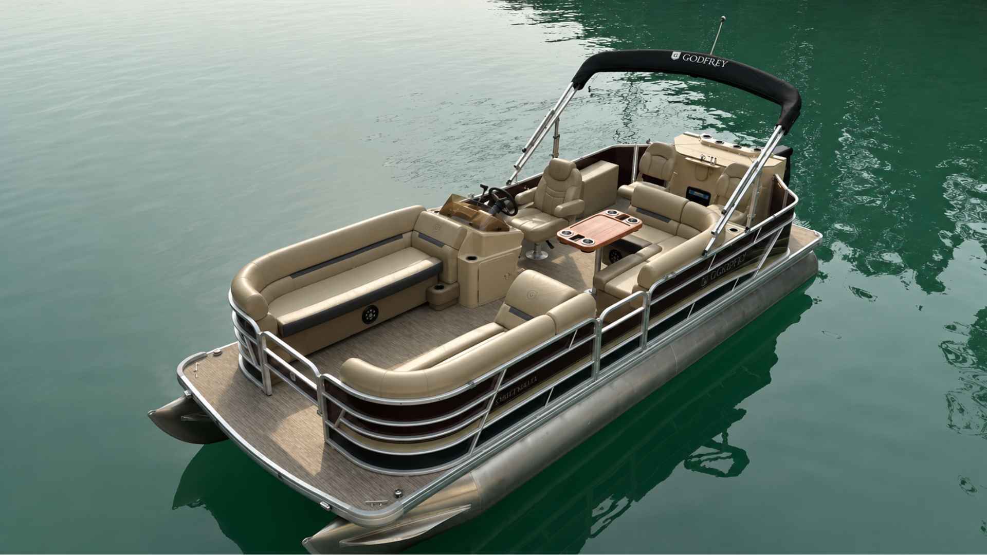 Luxury beige pontoon boat floating on calm green water, aerial view with spacious seating and canopy.