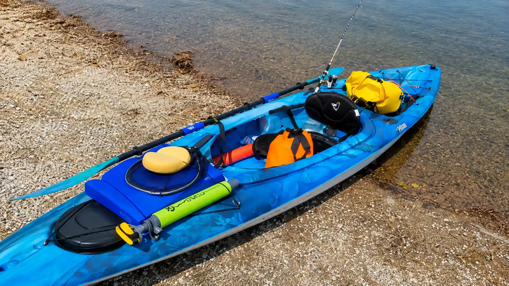 Pelican Mustang 120X kayak on shore with gear