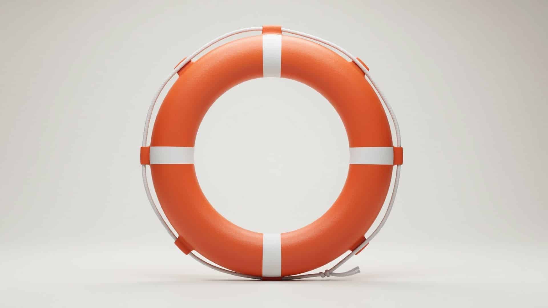 Orange and white Type IV throwable ring buoy on a clean light background