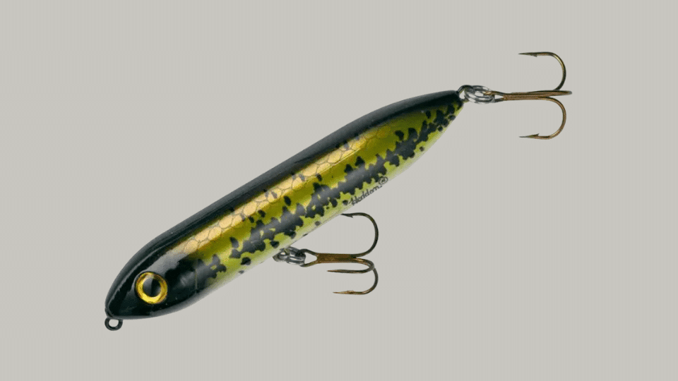 Heddon Super Spook Jr topwater fishing lure with walking action on a plain background