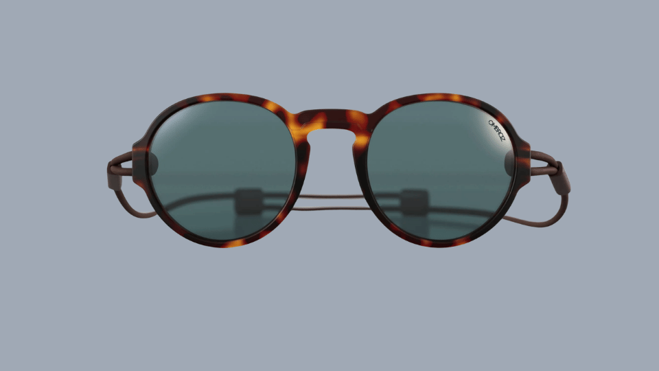 Ombraz Viale armless polarized fishing sunglasses with adjustable cord design on a plain background