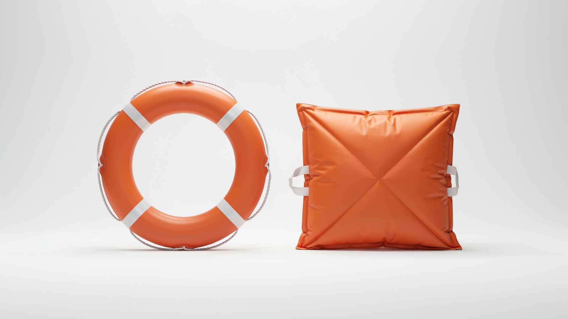 Life buoy and cushion on white background studio shot