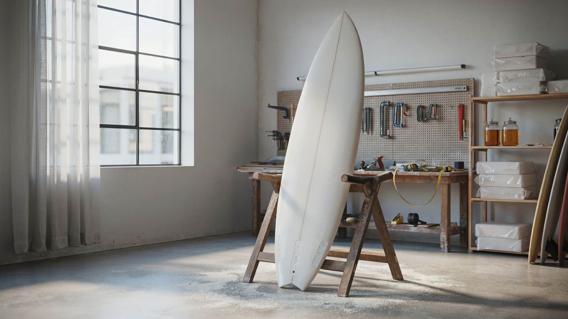 XPS foam surfboard standing on a rack inside a surfboard shaping workshop