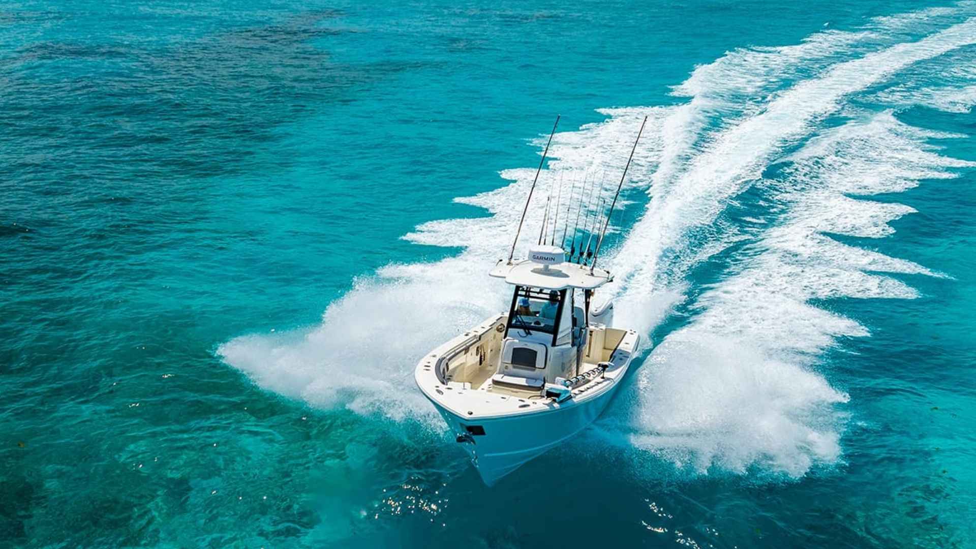 Cobia center console fishing boat with twin outboards on open water