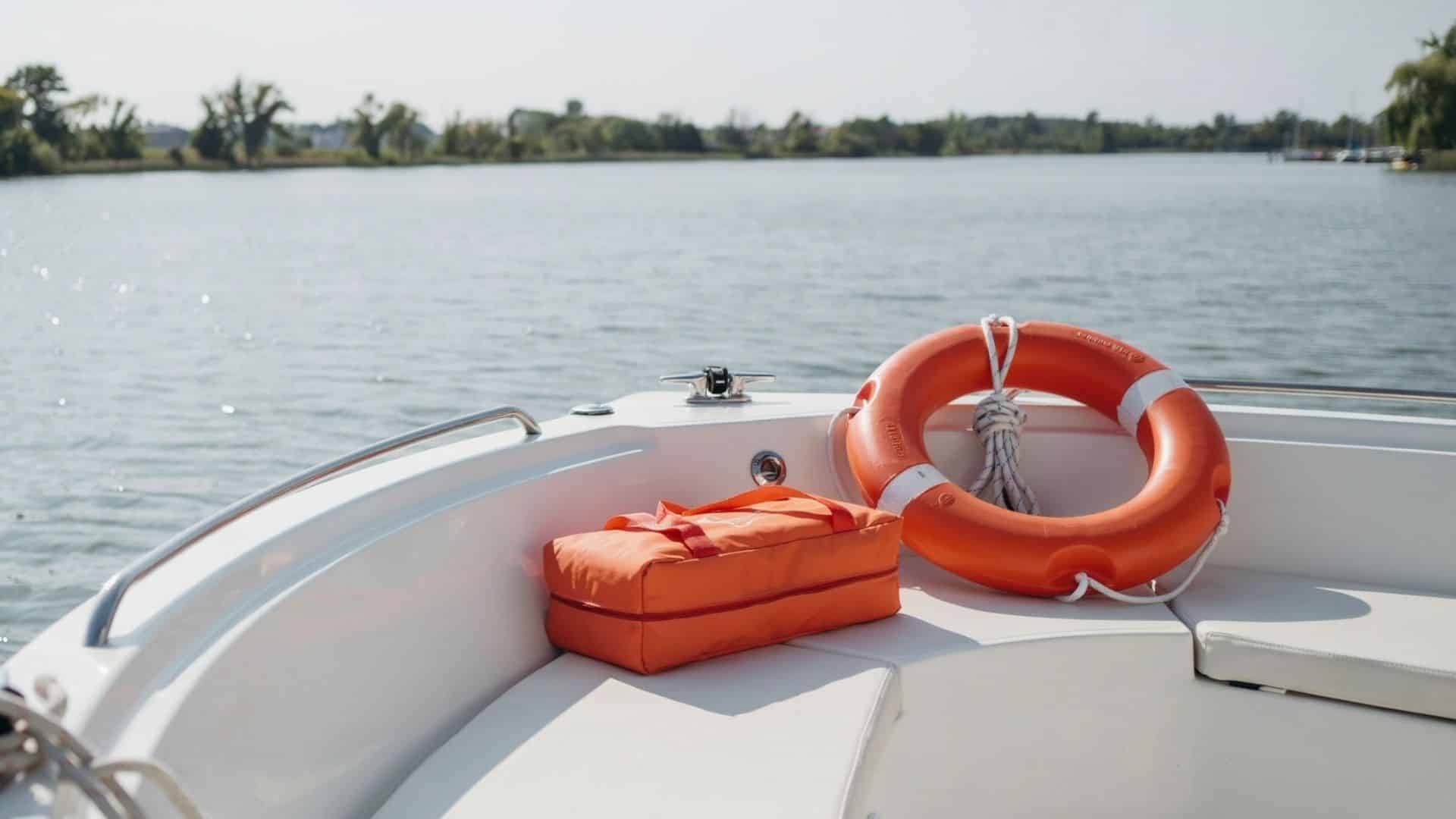 Ring buoy and throwable flotation cushion on a recreational boat, showing the two common Type IV personal flotation devices.