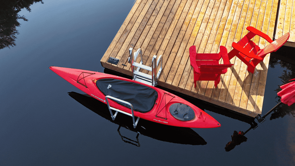 Golden Boat Lifts Kayak Launch Elevator Mechanical kayak lift system raising a kayak above water at a tidal dock.