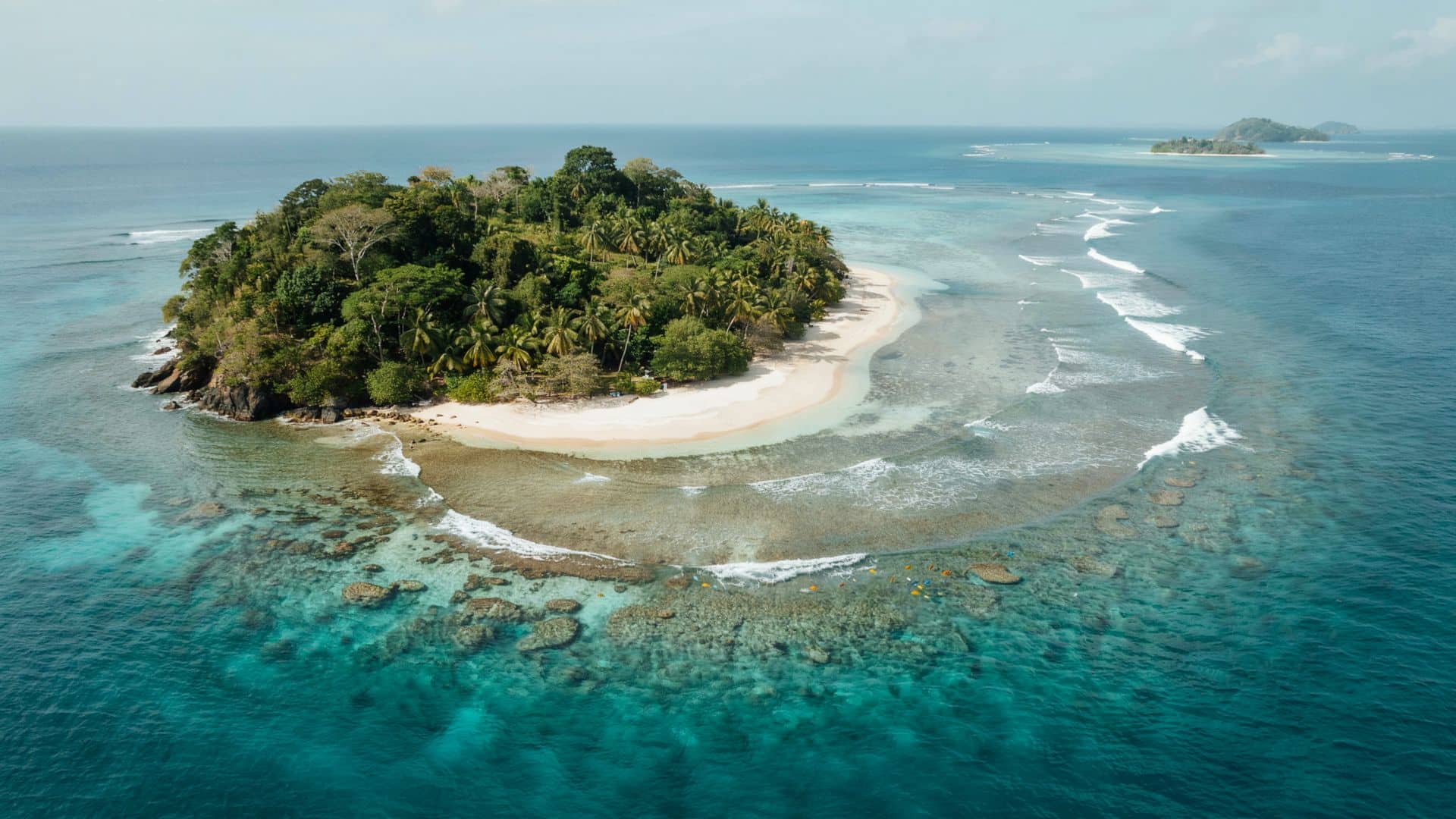 Marino Ballena National Park Costa Rica with whale tail shaped sandbar clear ocean water and lush coastal landscape