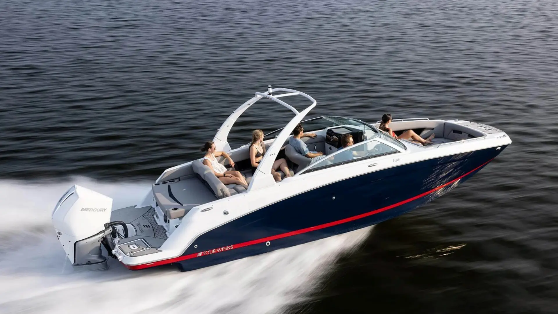 Modern deck boat speeding on open water with spacious seating and sleek hull design for family boating