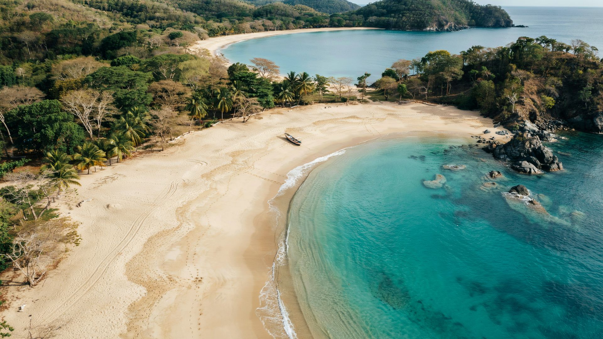 Playa Panama Costa Rica showing calm turquoise bay waters sandy shoreline and tropical greenery along the sheltered coast