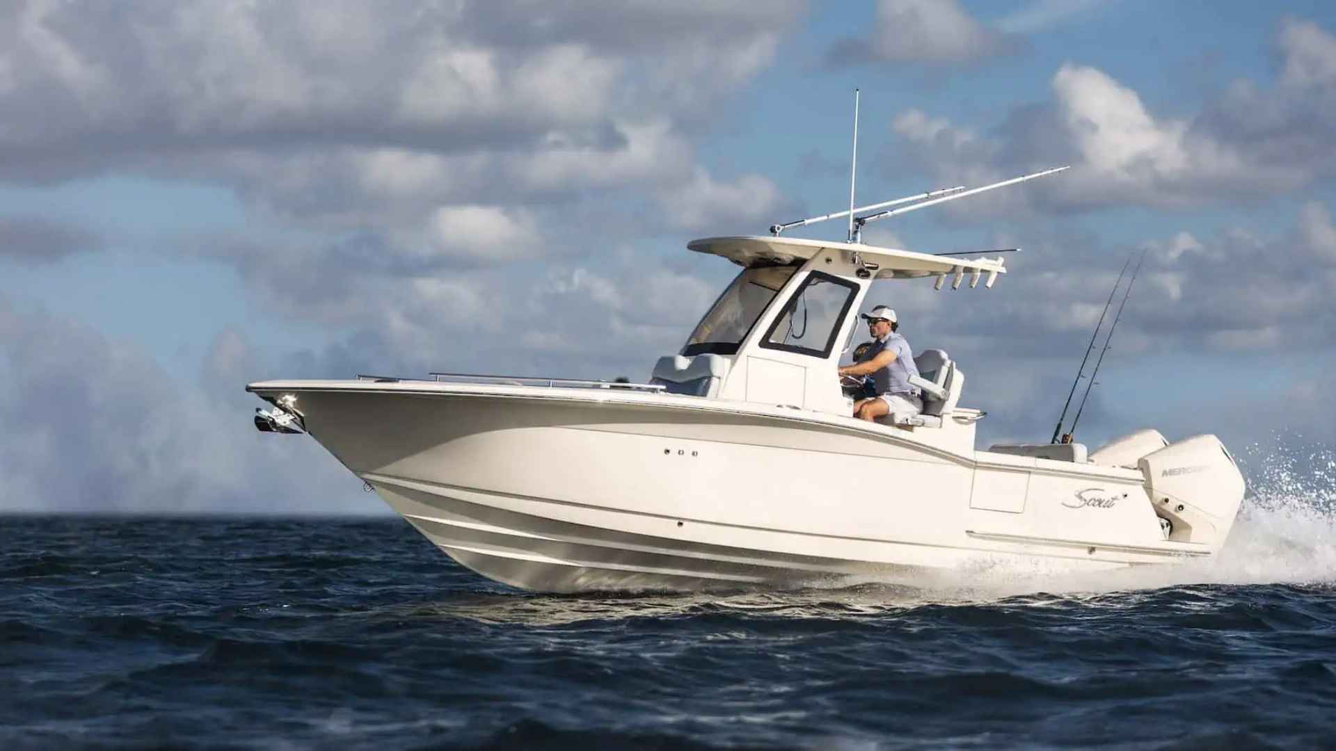 Scout 260 LXF center console boat docked near calm coastal waters
