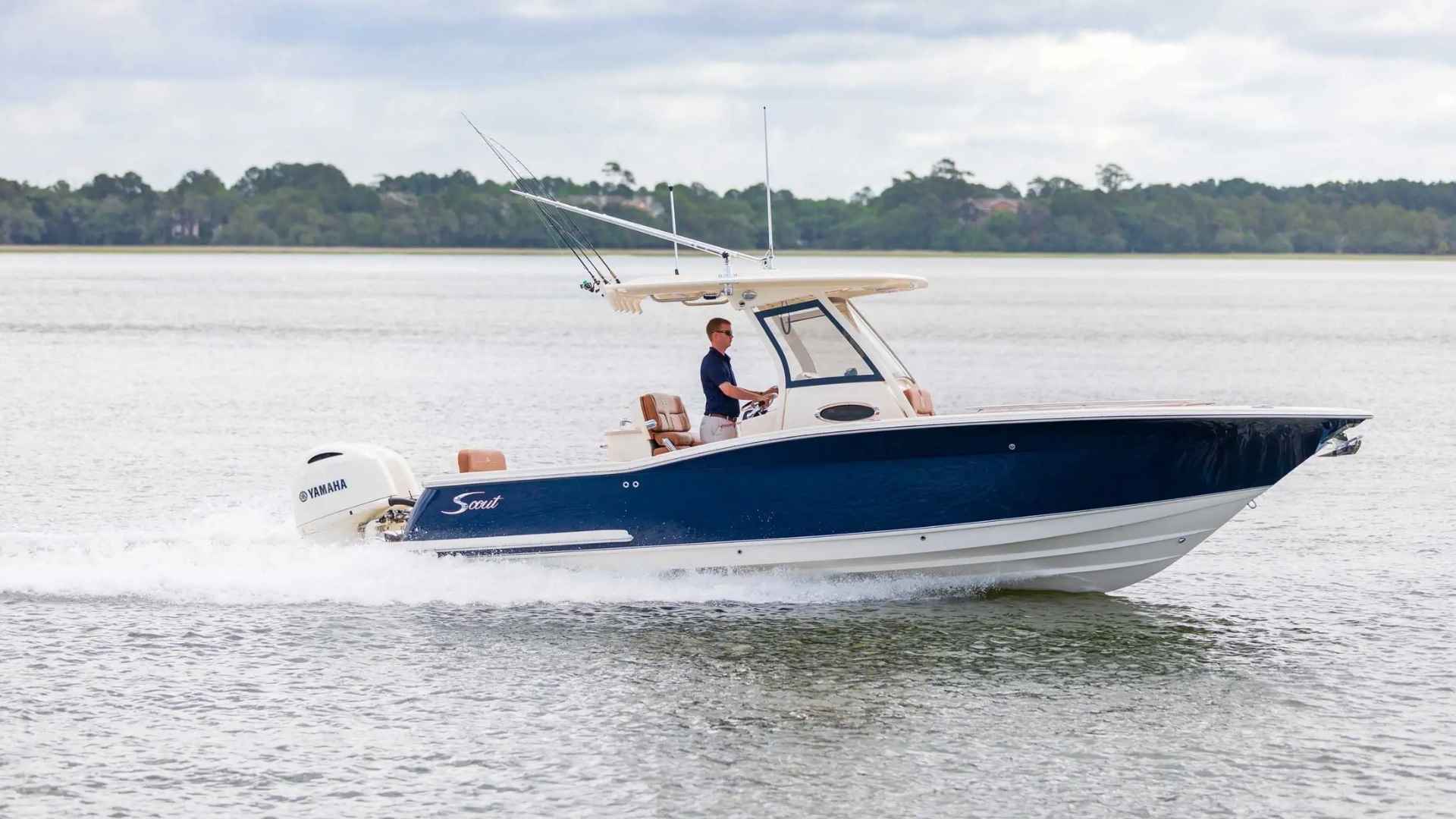Scout 277 LXF center console boat with stepped hull design on the water