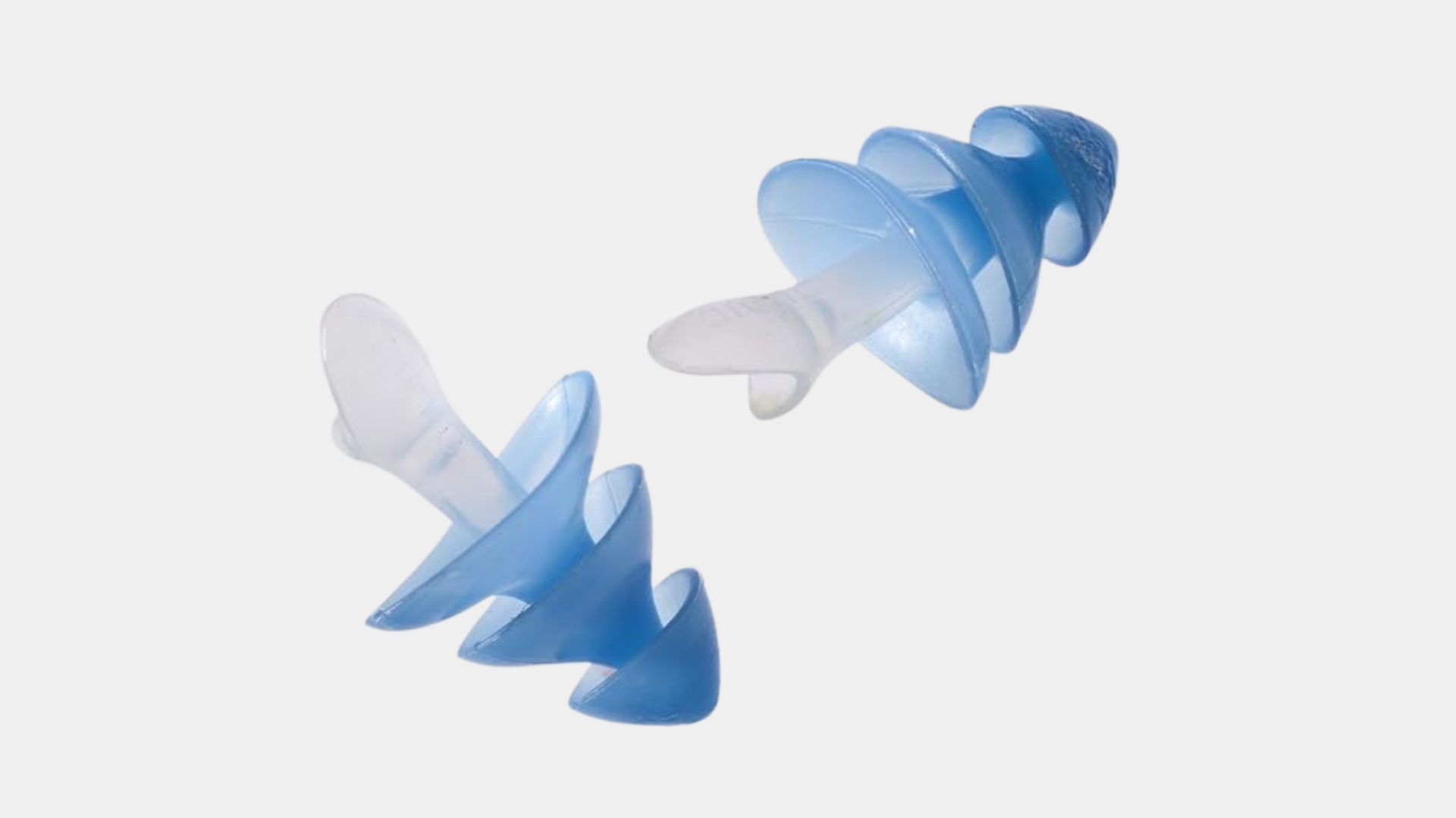 Two blue multi-flanged earplugs with clear stems against a light background