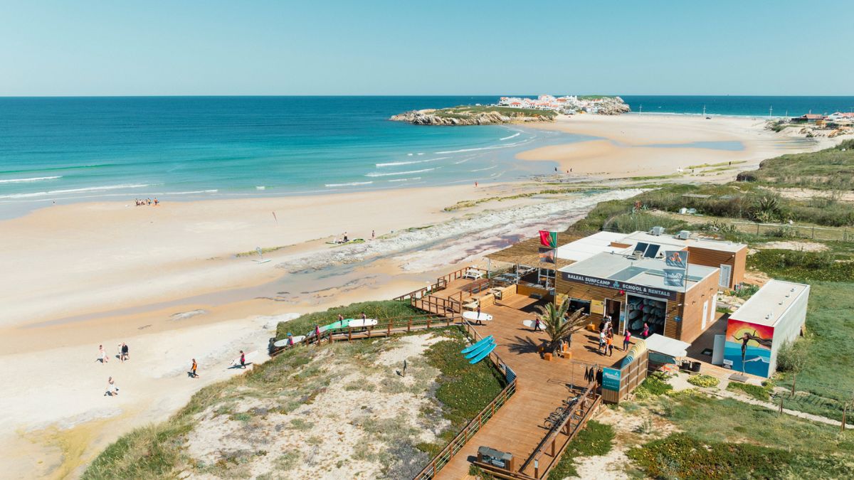 Baleal beach in Portugal with surf school, boards, and beginner-friendly waves along the coastline
