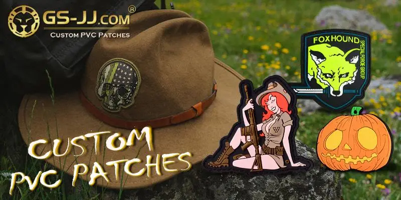 Brown hat with embroidered skull patch on grass alongside custom PVC patches
