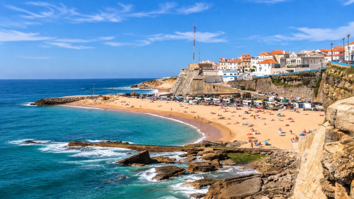 Ericeira coastline with sandy beach, Atlantic waves, rocky cliffs, and coastal village overlooking the surf destination