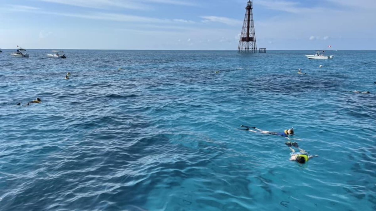 Aerial view of Sombrero Reef near Marathon with boats, shallow turquoise water, and coral reef areas in the Florida Keys